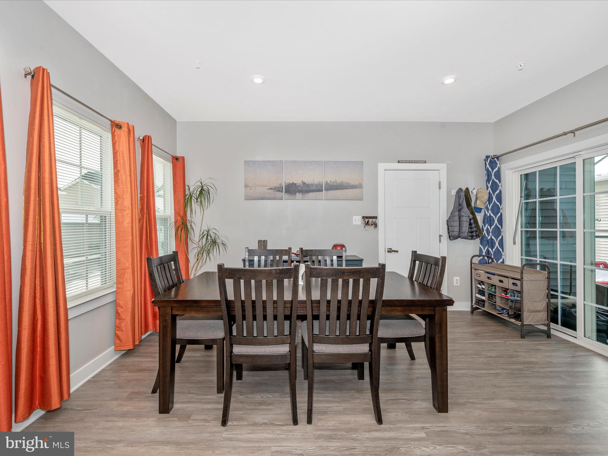6649 Ballenger Run Boulevard Frederick, MD 21703 - Photo 12 of 42 a view of a dining room with furniture window and wooden floor