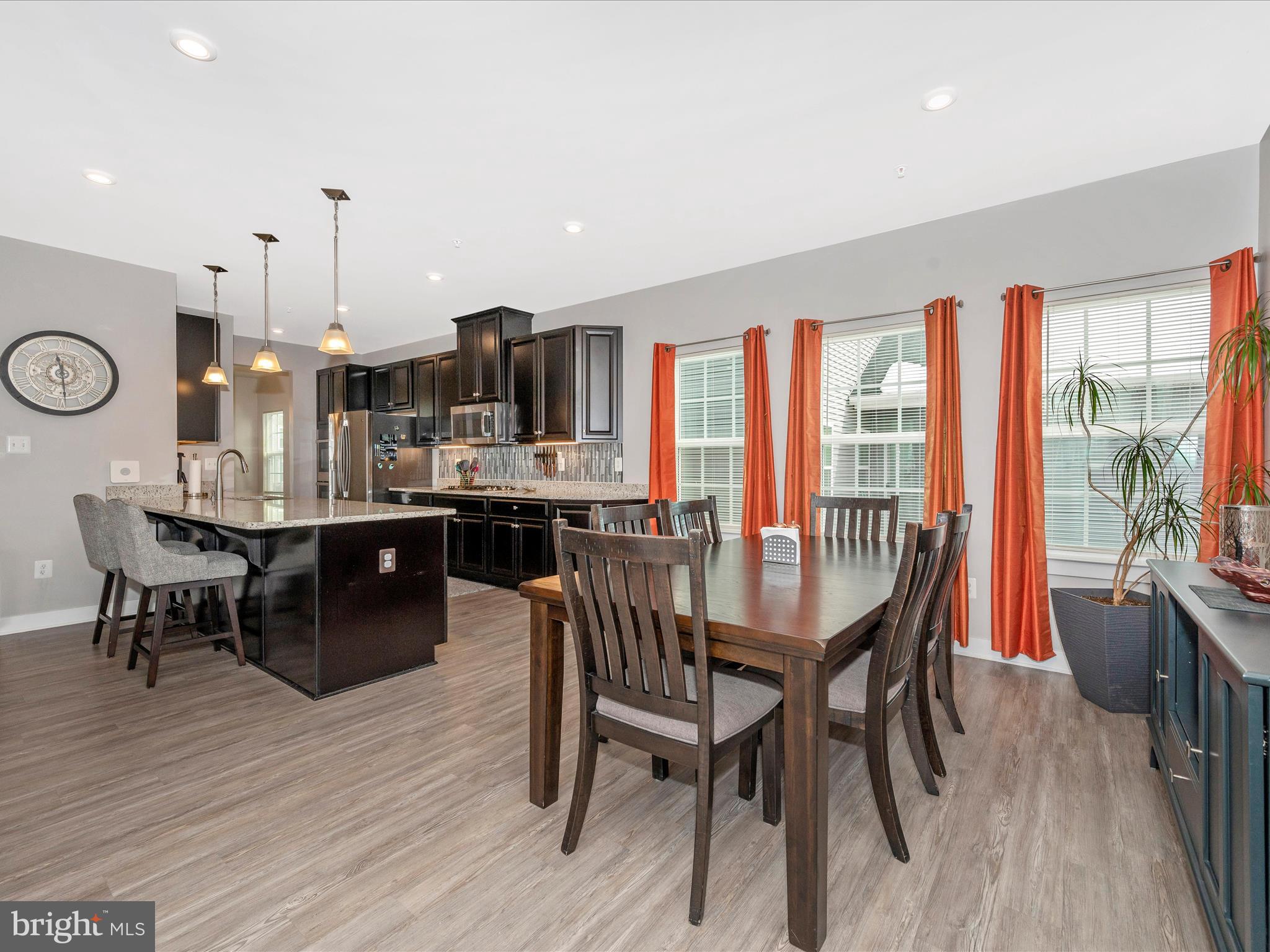 6649 Ballenger Run Boulevard Frederick, MD 21703 - Photo 13 of 42 a dining room with furniture and wooden floor