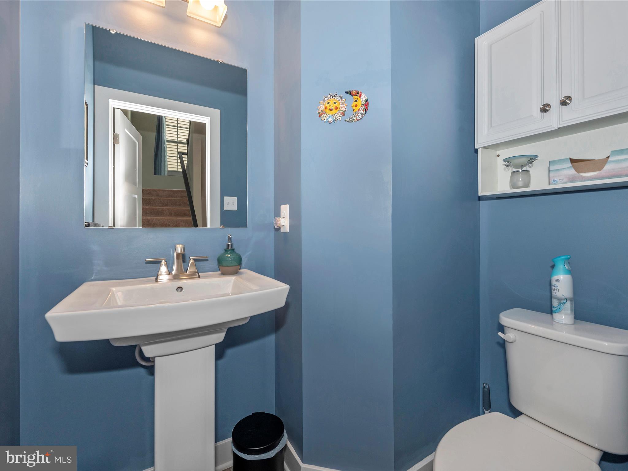 6649 Ballenger Run Boulevard Frederick, MD 21703 - Photo 15 of 42 a bathroom with a sink a mirror and a toilet