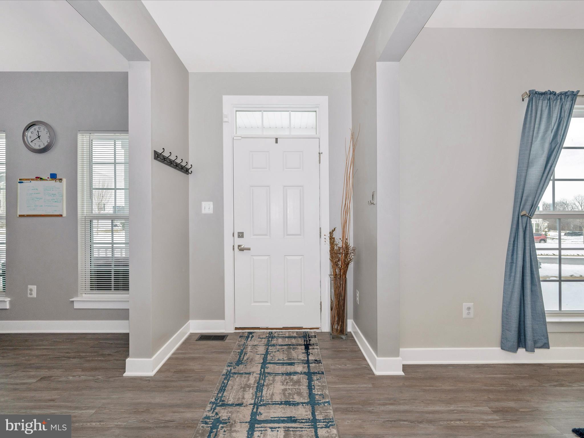 6649 Ballenger Run Boulevard Frederick, MD 21703 - Photo 2 of 42 an empty room with wooden floor and windows
