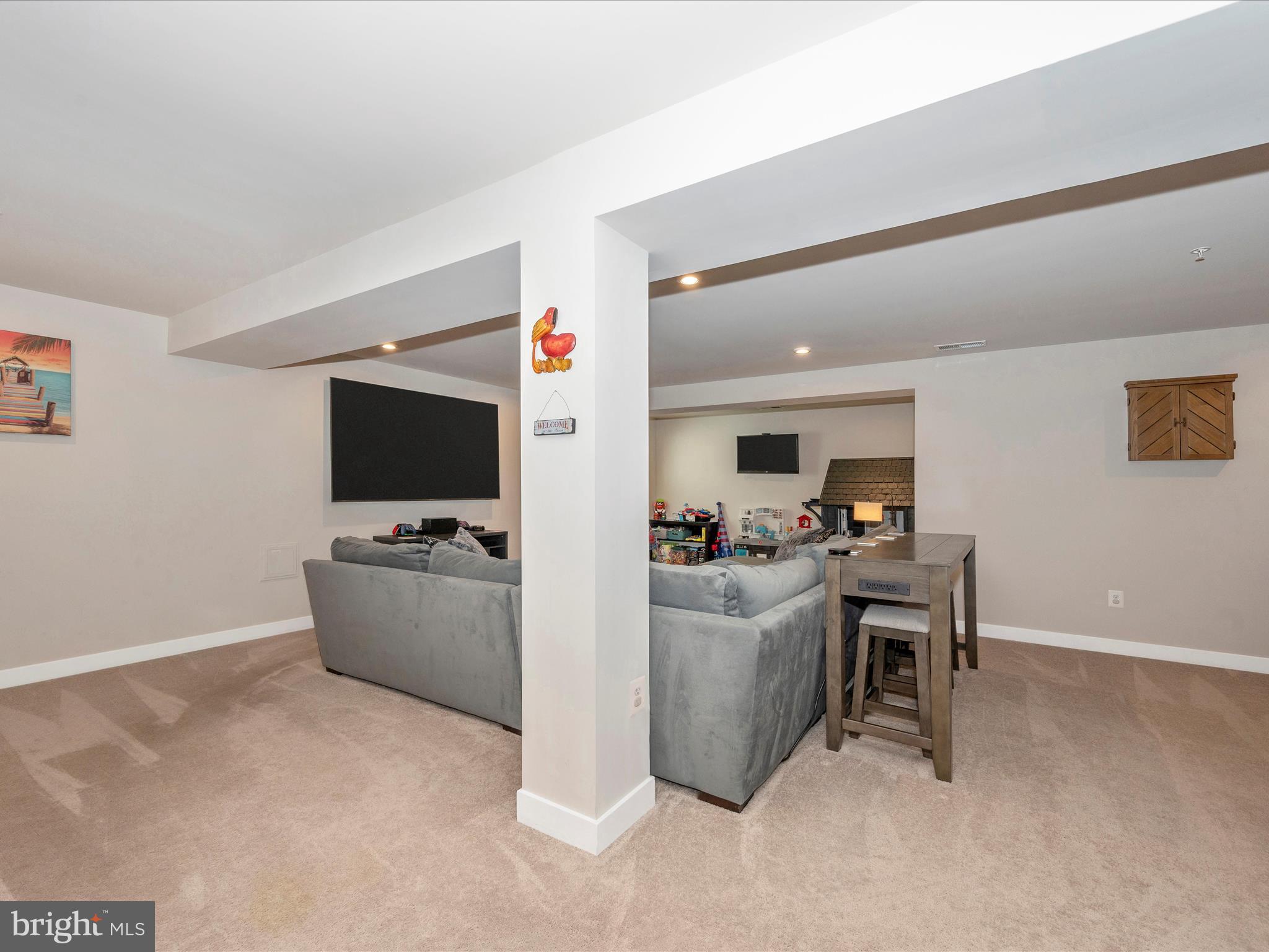 6649 Ballenger Run Boulevard Frederick, MD 21703 - Photo 26 of 42 a living room with furniture and a flat screen tv