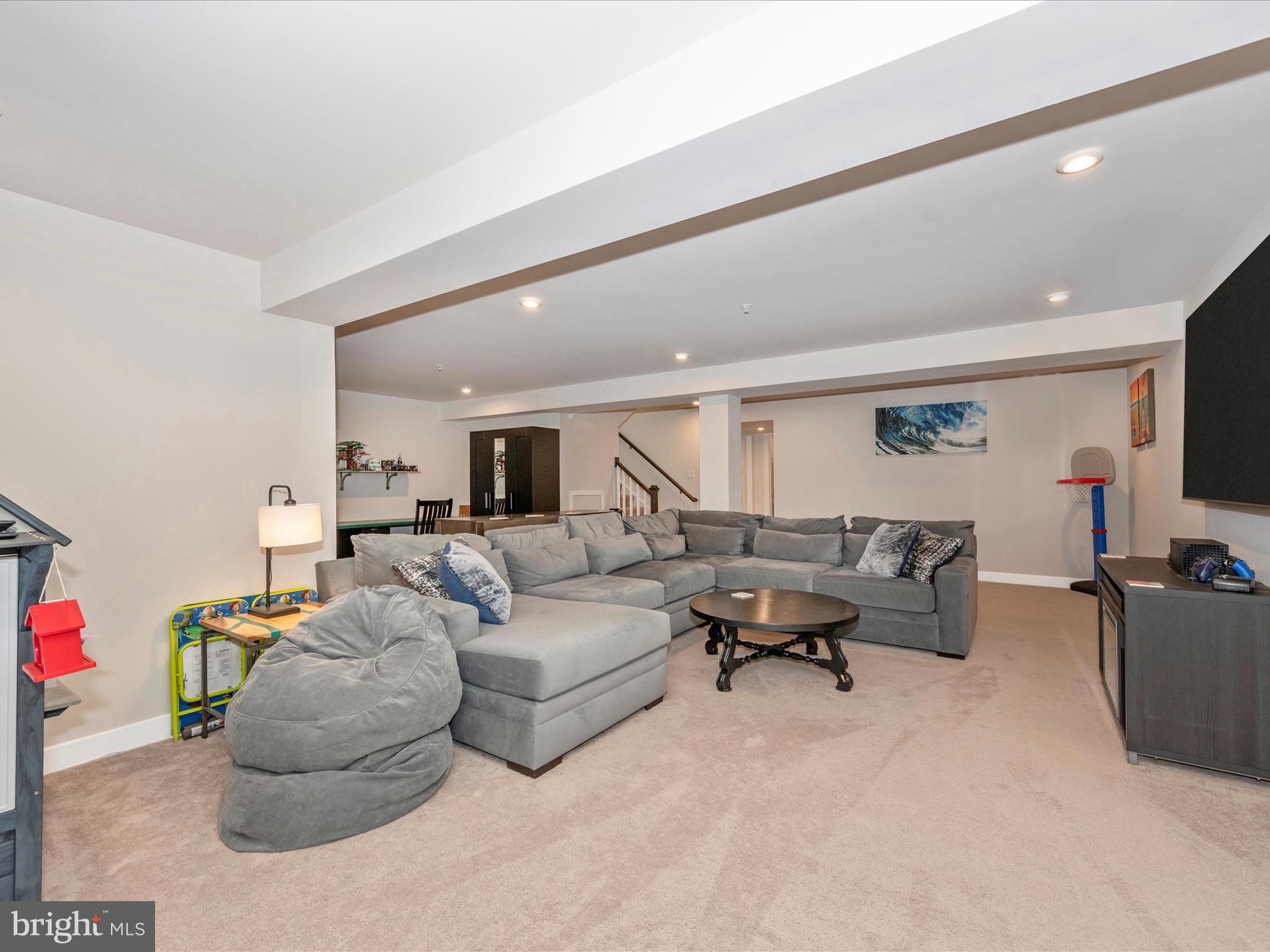 6649 Ballenger Run Boulevard Frederick, MD 21703 - Photo 29 of 42 a living room with furniture and a flat screen tv