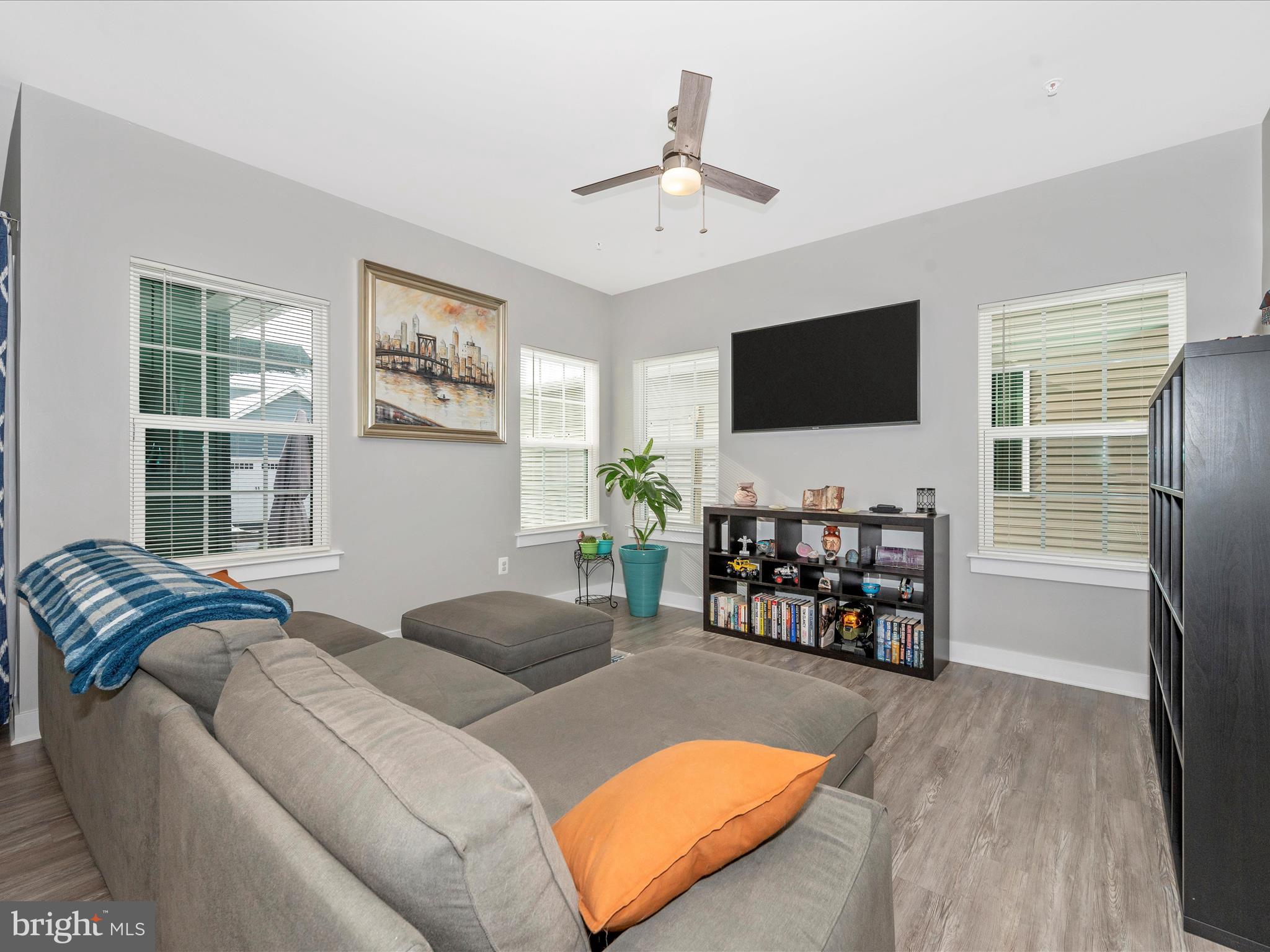 6649 Ballenger Run Boulevard Frederick, MD 21703 - Photo 3 of 42 a living room with furniture and a flat screen tv with wooden floor