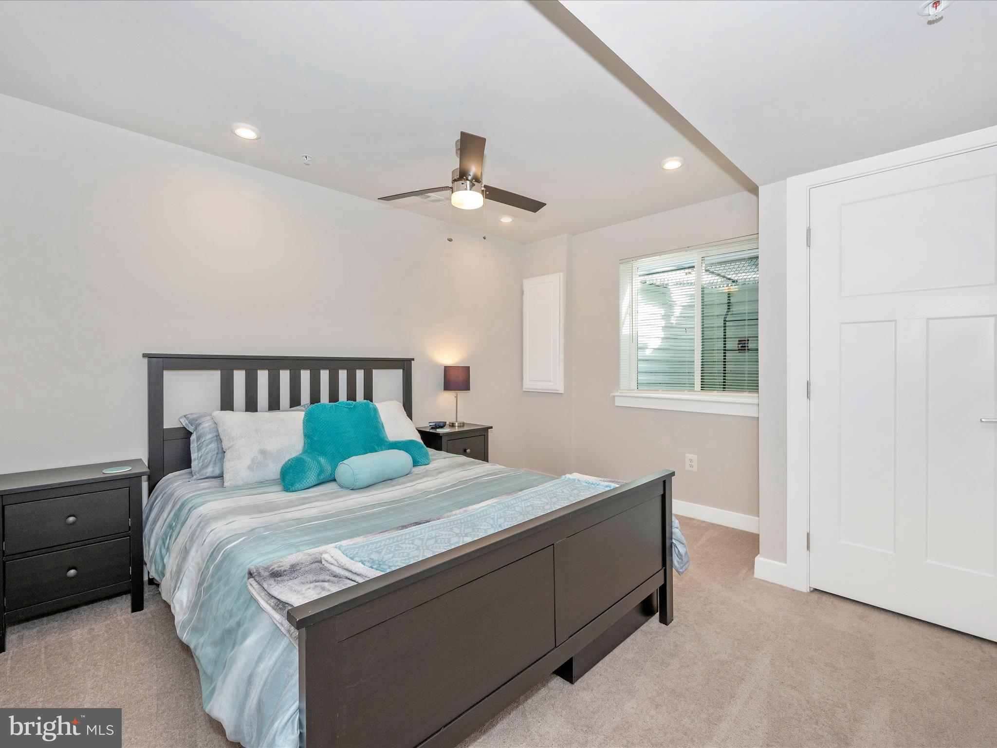 6649 Ballenger Run Boulevard Frederick, MD 21703 - Photo 31 of 42 a bedroom with a bed and a chandelier