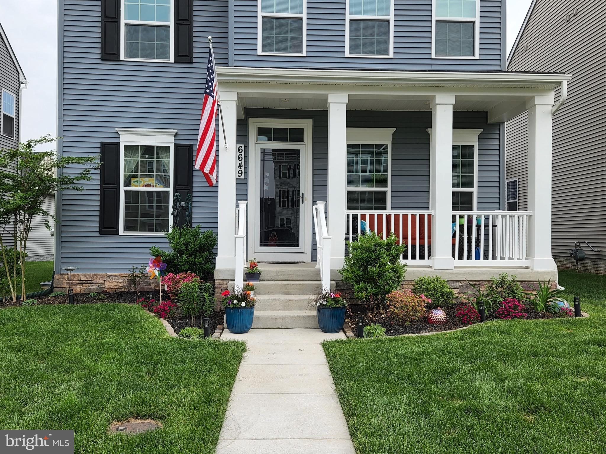 6649 Ballenger Run Boulevard Frederick, MD 21703 - Photo 41 of 42 a front view of a house with a yard