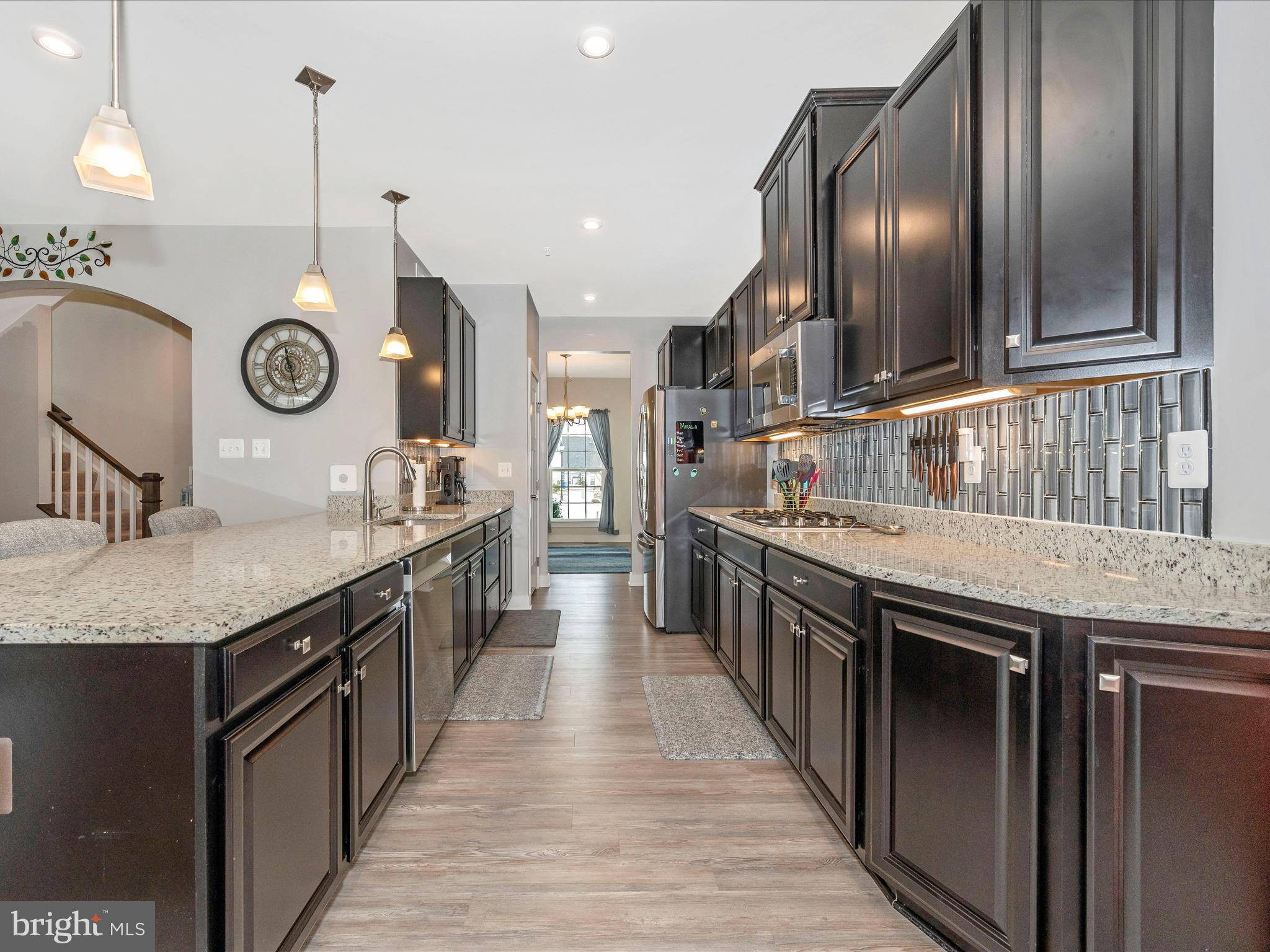 6649 Ballenger Run Boulevard Frederick, MD 21703 - Photo 9 of 42 a kitchen with stainless steel appliances granite countertop stove top oven and cabinets