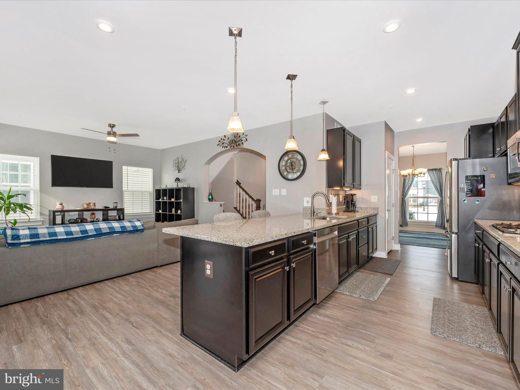 6649 Ballenger Run Boulevard Frederick, MD 21703 - Photo 10 of 42 a kitchen with a stove and a wooden floor