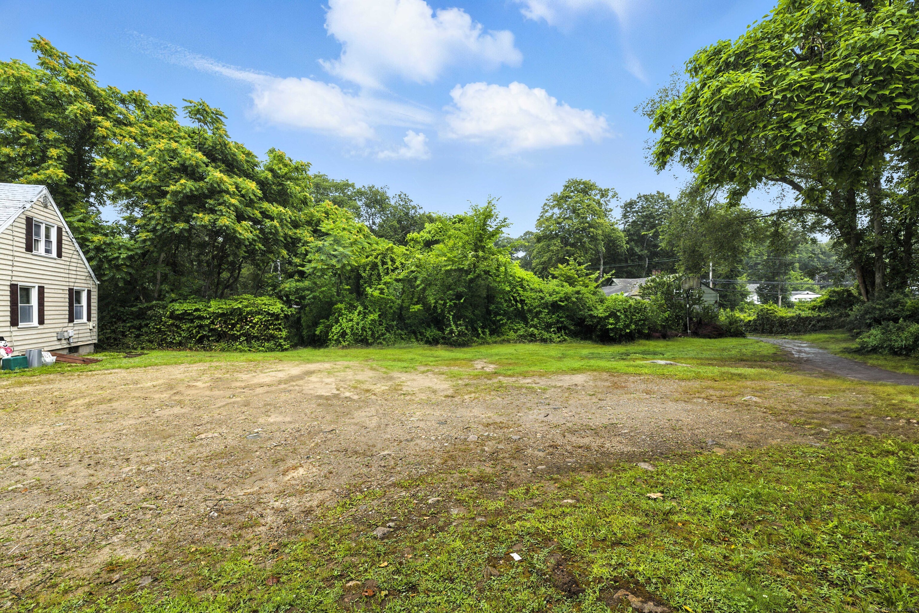 398 Boston Post Road Waterford, CT 06385 - Photo 21 of 40 a view of a yard with plants and large trees
