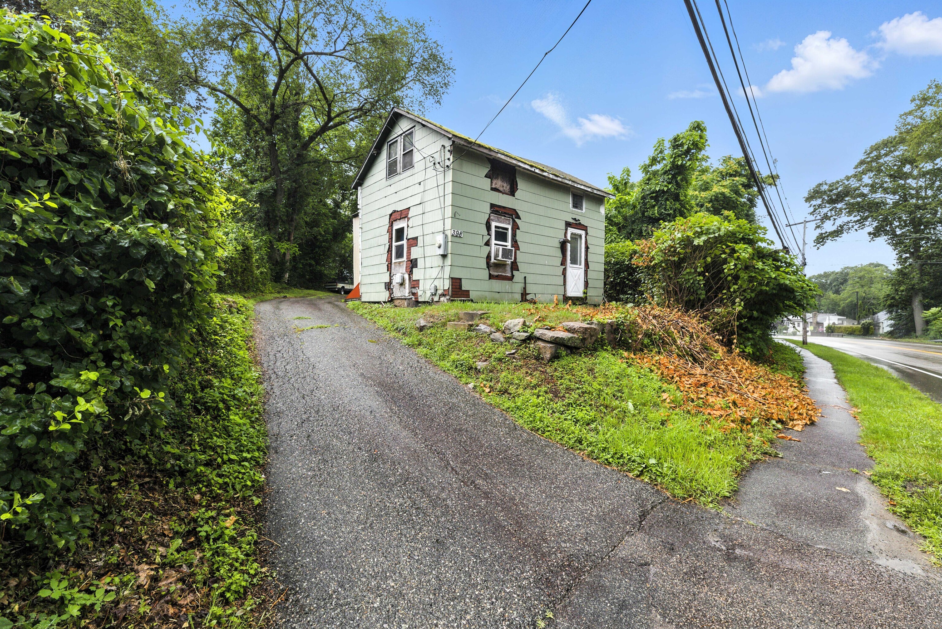398 Boston Post Road Waterford, CT 06385 - Photo 23 of 40 a front view of a house with garden