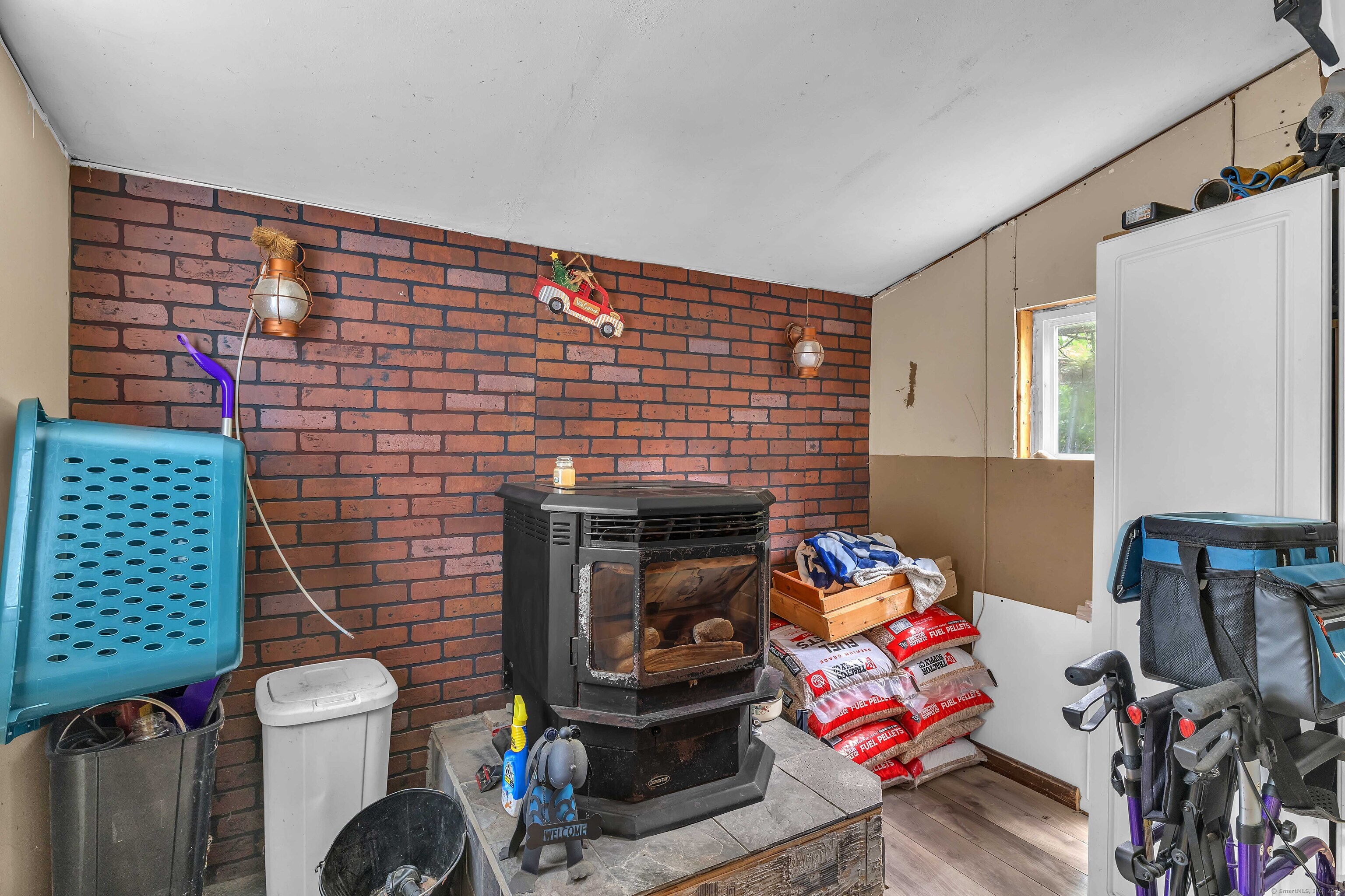 398 Boston Post Road Waterford, CT 06385 - Photo 24 of 40 a room with furniture and a fireplace