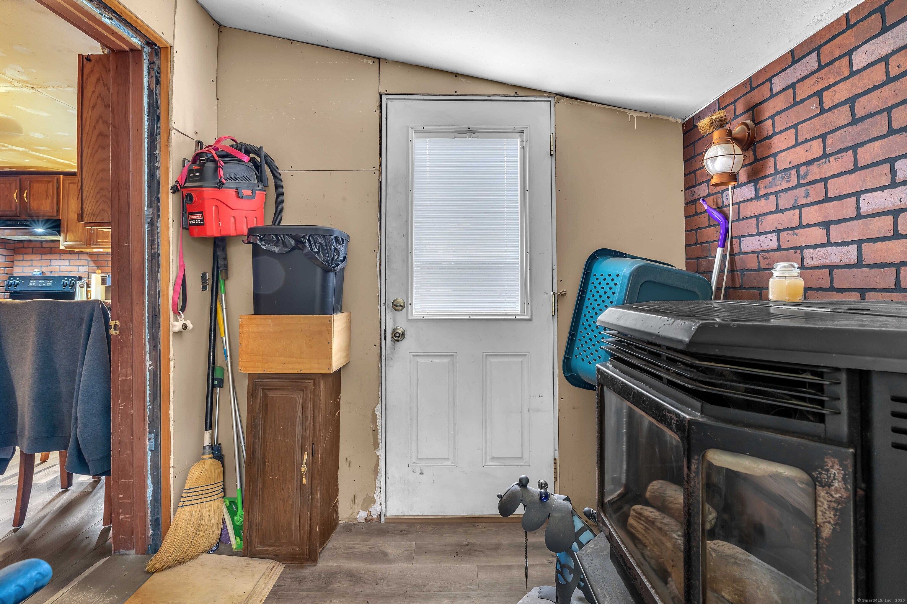 398 Boston Post Road Waterford, CT 06385 - Photo 25 of 40 a bedroom with a bed and a chandelier