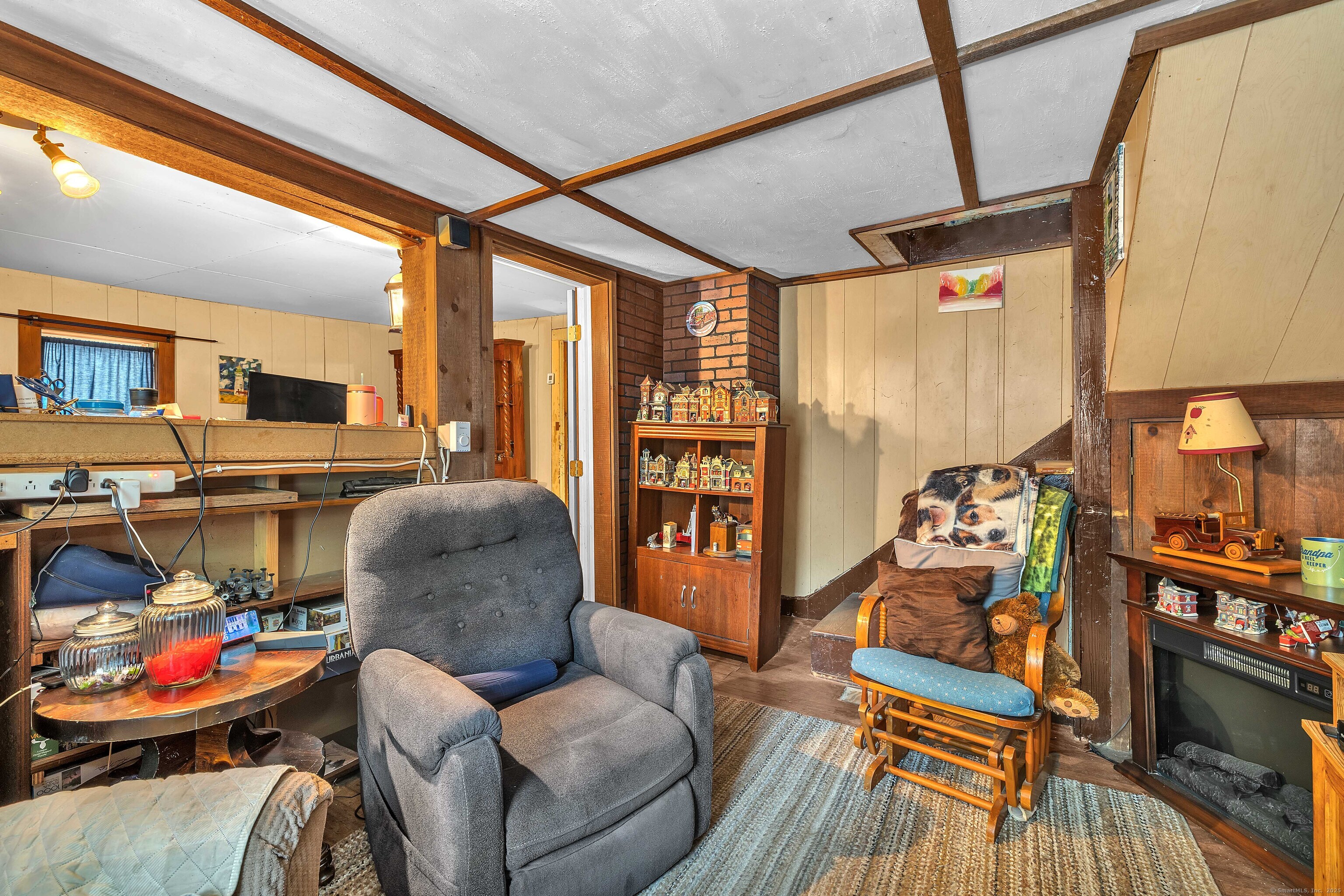 398 Boston Post Road Waterford, CT 06385 - Photo 33 of 40 a living room with furniture and a floor to ceiling window