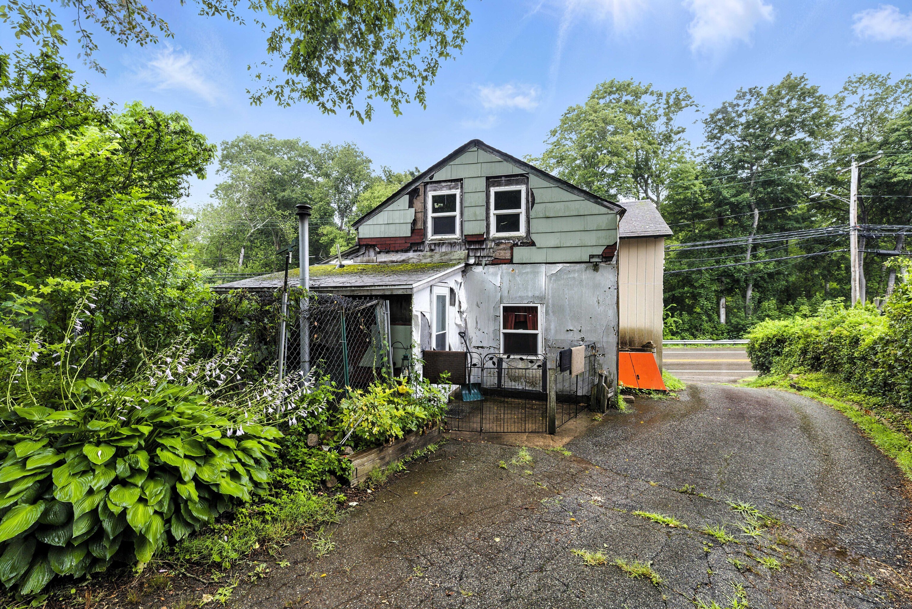 398 Boston Post Road Waterford, CT 06385 - Photo 40 of 40 a view of a house with backyard and sitting area
