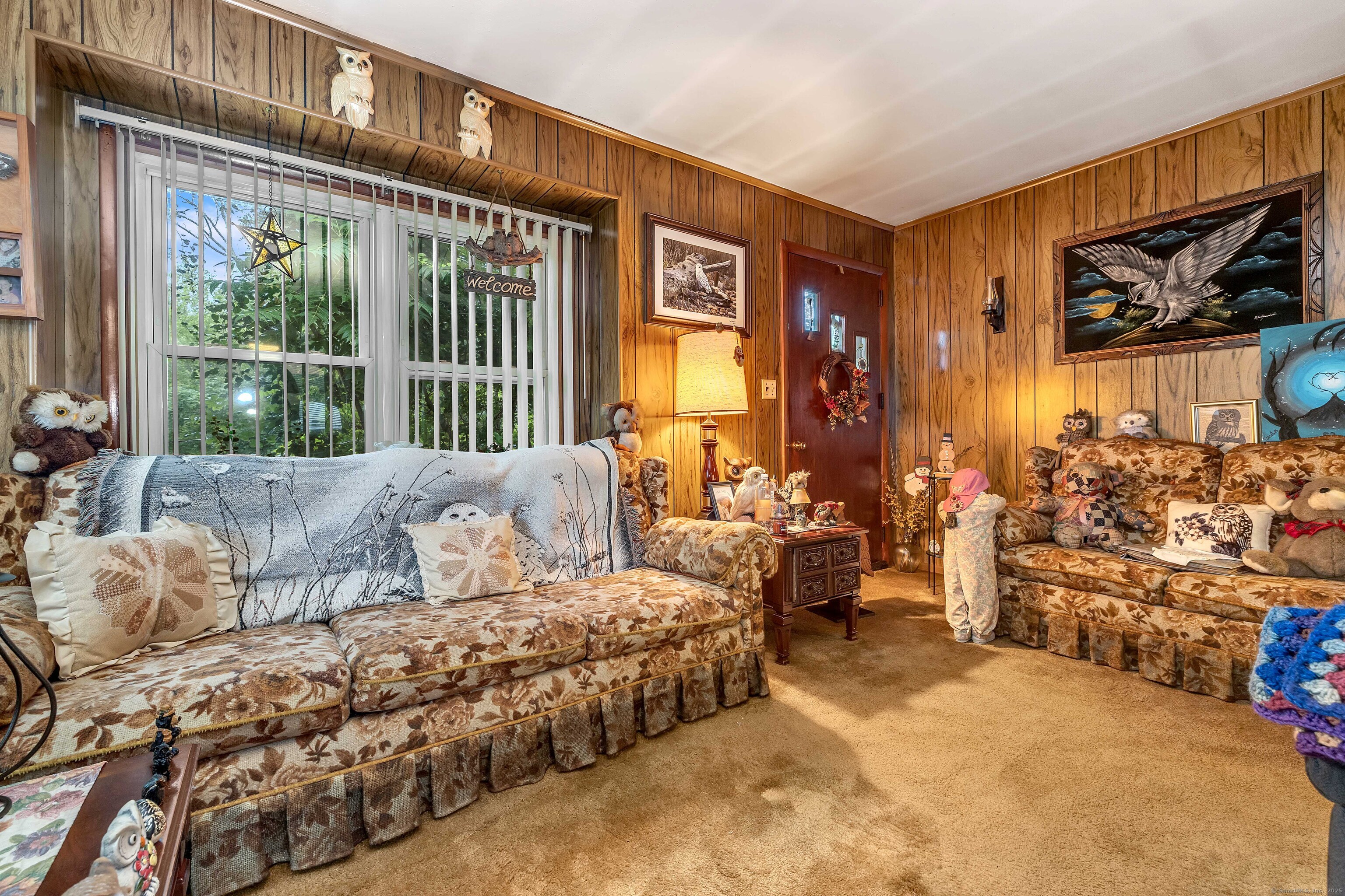 398 Boston Post Road Waterford, CT 06385 - Photo 5 of 40 a large bedroom with a bed and glass windows