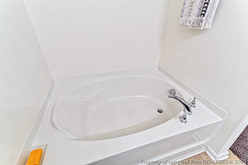 448 Botanical Court Bunnlevel, NC 28323 - Photo 23 of 37 a bathroom with a bathtub