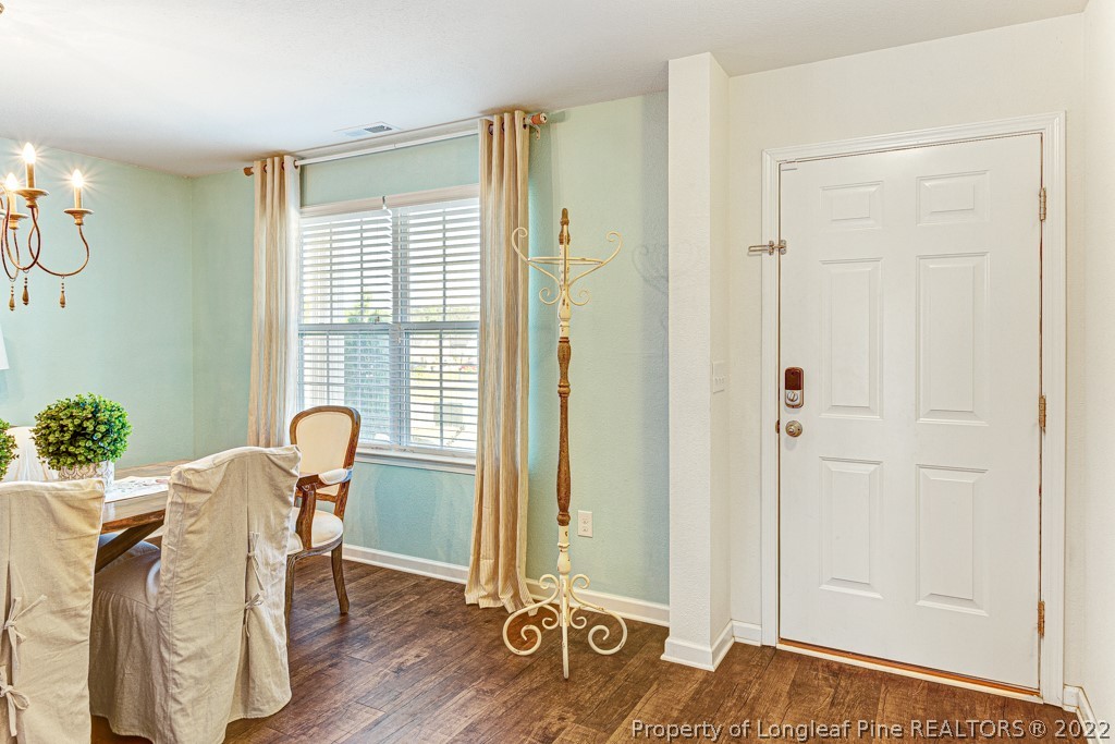 448 Botanical Court Bunnlevel, NC 28323 - Photo 3 of 37 a view of a room with furniture and wooden floor