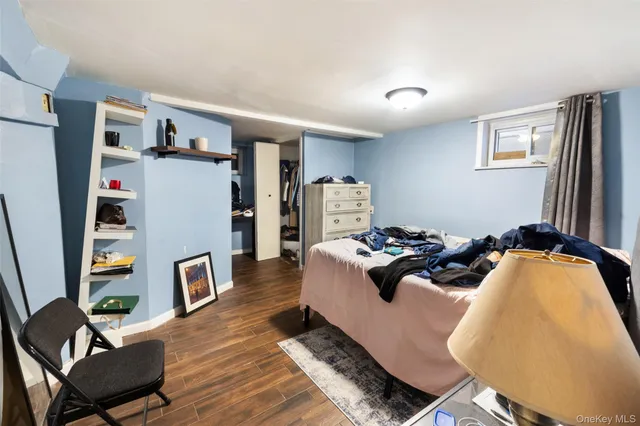 a bedroom with bed and a couch