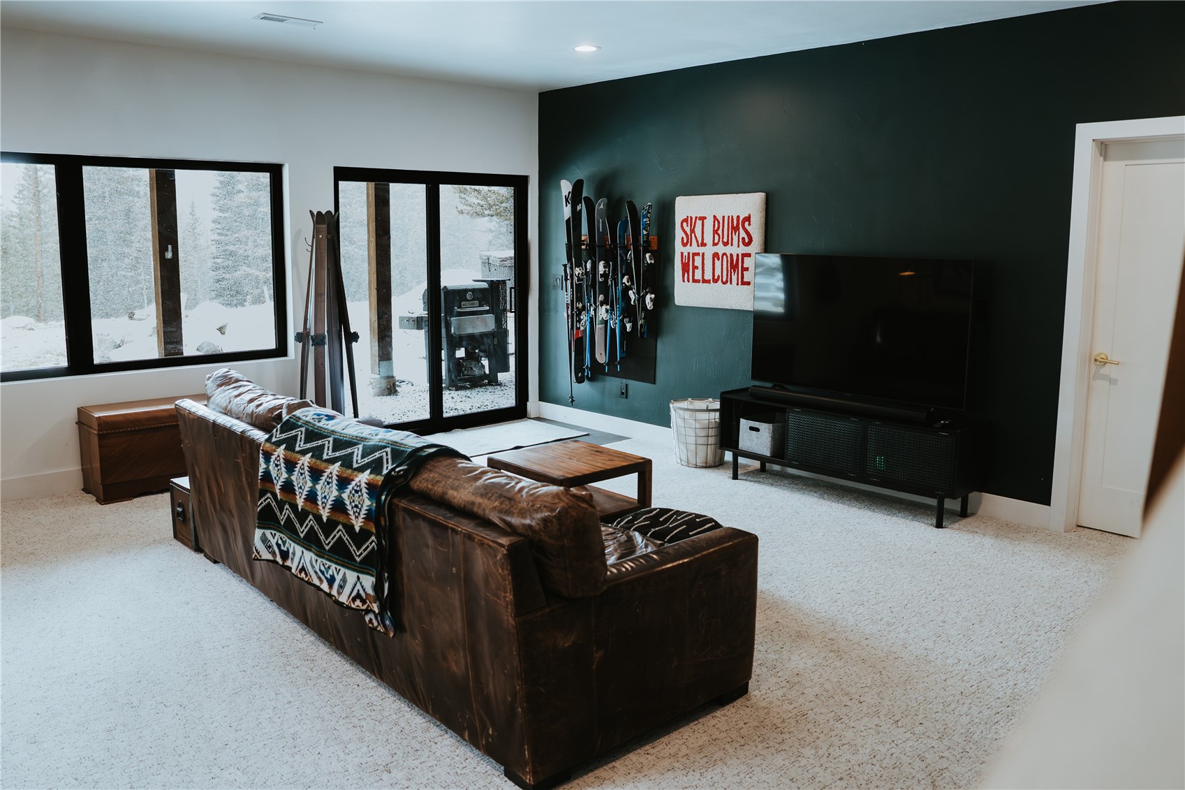 223 Guymard Road Fairplay, CO 80440 - Photo 23 of 49 a living room with furniture projector and a flat screen tv