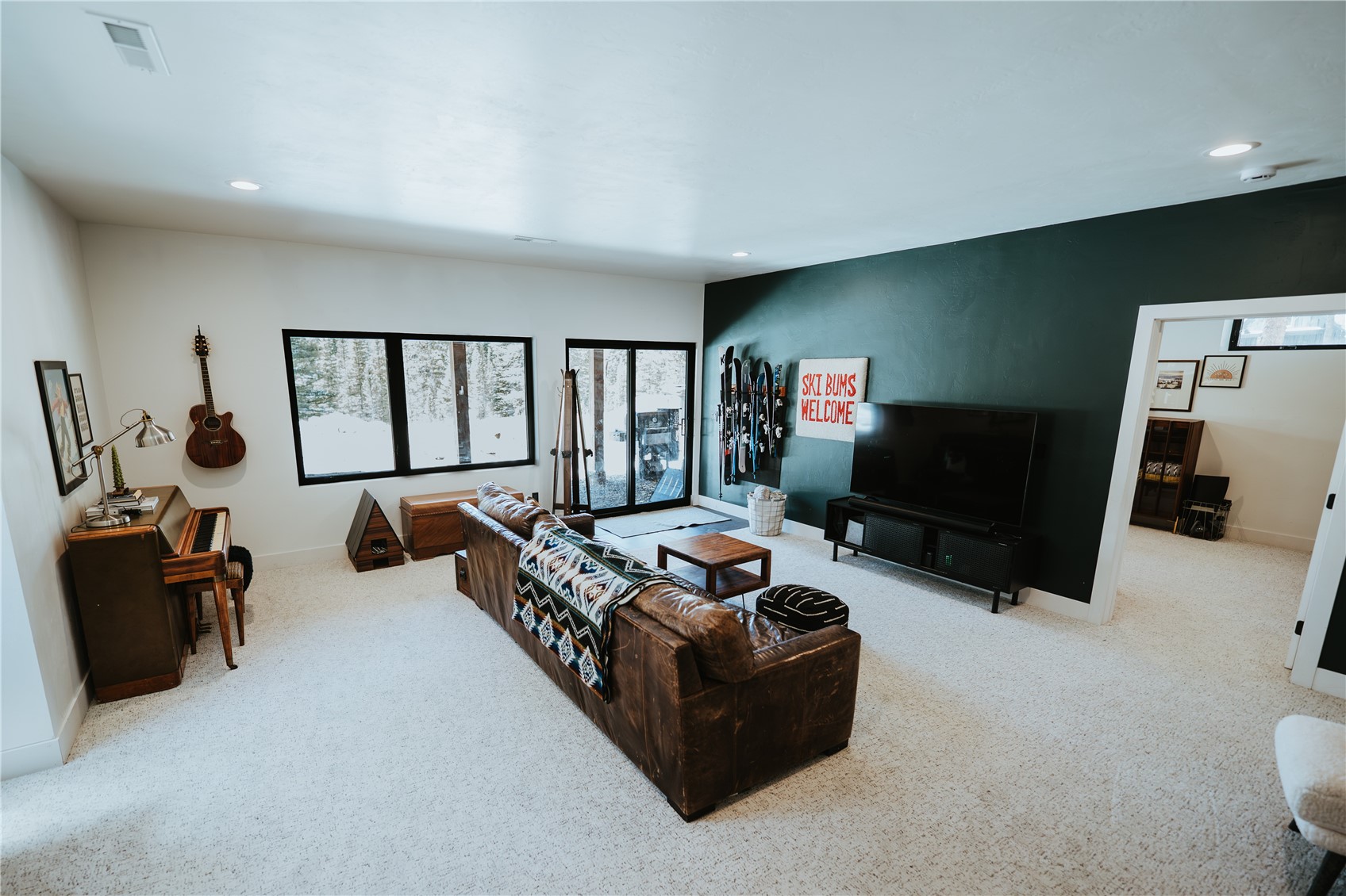 223 Guymard Road Fairplay, CO 80440 - Photo 24 of 49 a living room with furniture and a flat screen tv