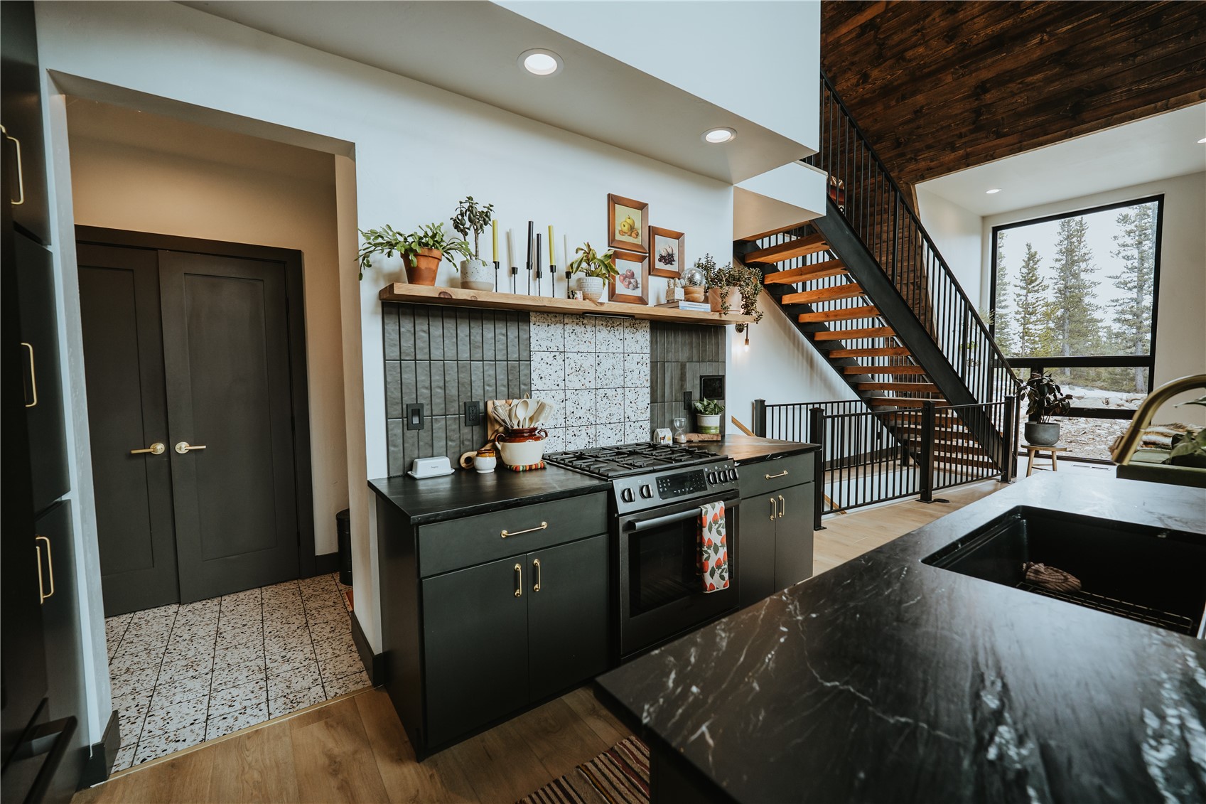 223 Guymard Road Fairplay, CO 80440 - Photo 43 of 49 a kitchen with stainless steel appliances granite countertop a stove and a sink