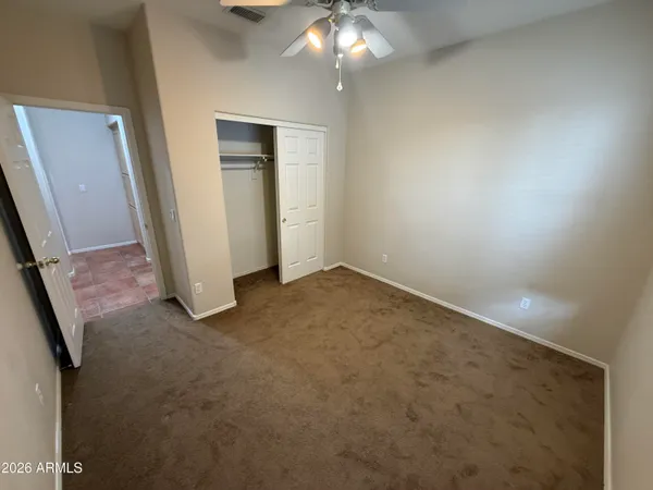 an empty room with a mirror