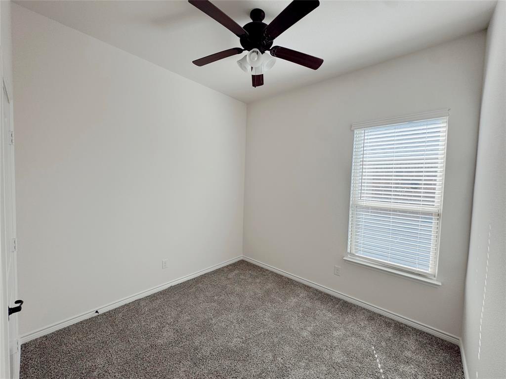 1076 Sublime Drive Forney, TX 75126 - Photo 12 of 40 a view of a livingroom with a ceiling fan and window