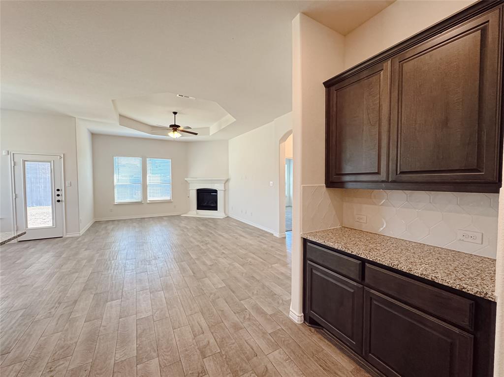 1076 Sublime Drive Forney, TX 75126 - Photo 14 of 40 a view of an empty room with window and wooden floor