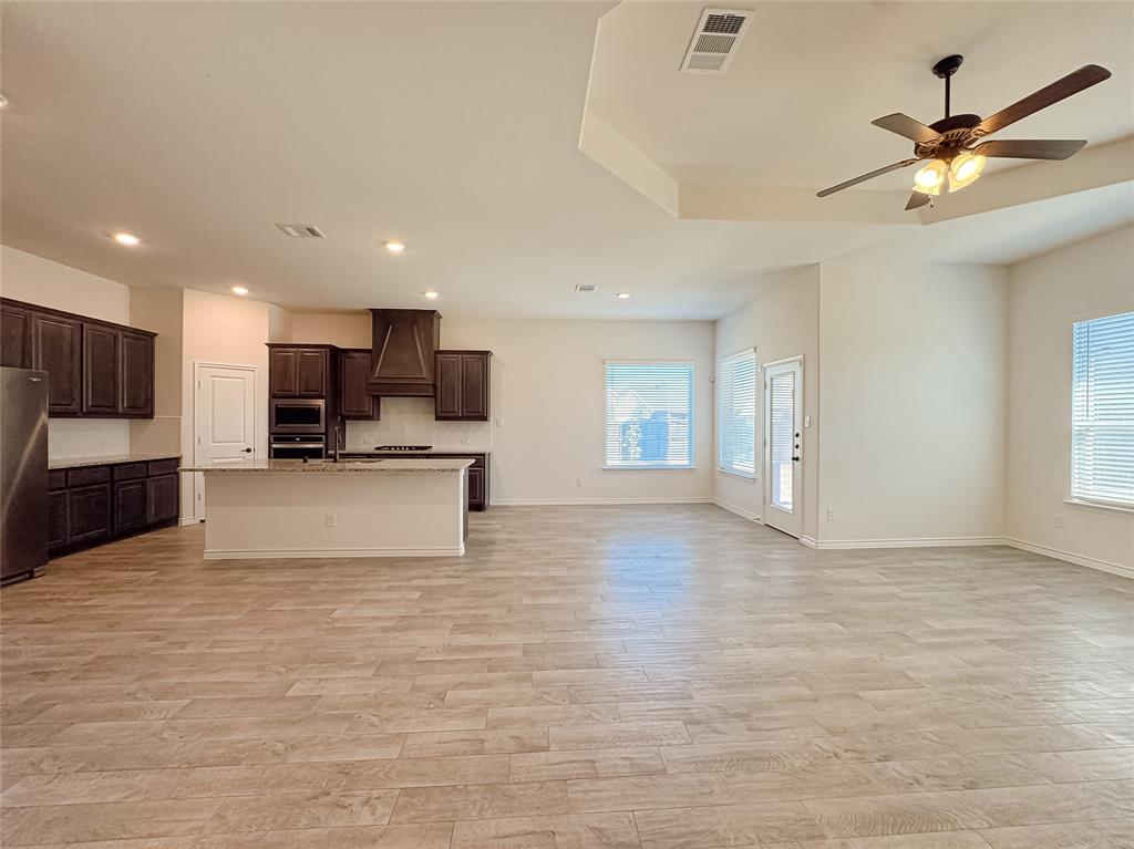 1076 Sublime Drive Forney, TX 75126 - Photo 40 of 40 a view of kitchen with stainless steel appliances granite countertop a stove top oven a sink and a refrigerator