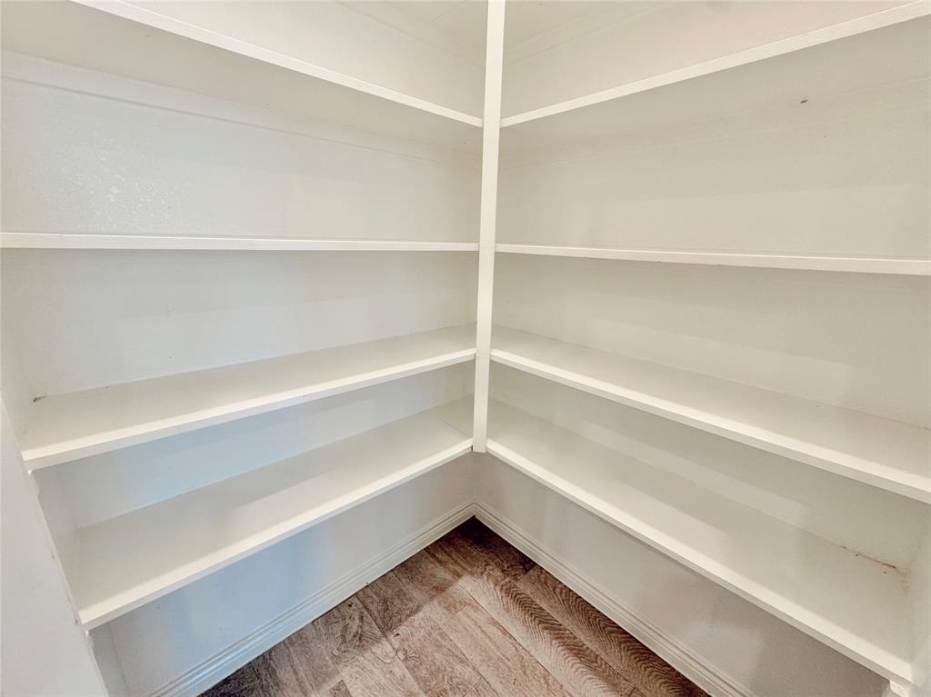 1076 Sublime Drive Forney, TX 75126 - Photo 19 of 40 a view of walk in closet with empty racks