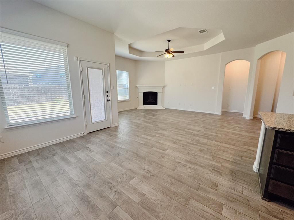 1076 Sublime Drive Forney, TX 75126 - Photo 20 of 40 a view of empty room with wooden floor and fan
