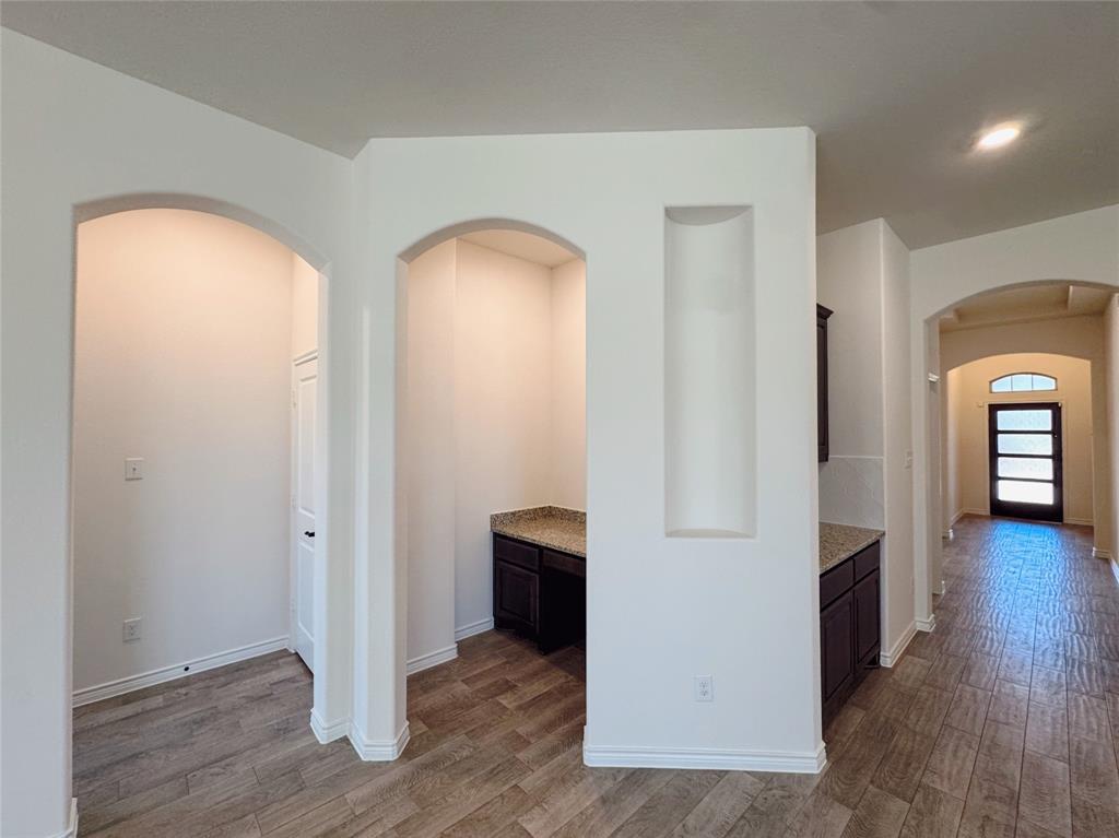 1076 Sublime Drive Forney, TX 75126 - Photo 23 of 40 wooden floor in an empty room with a window