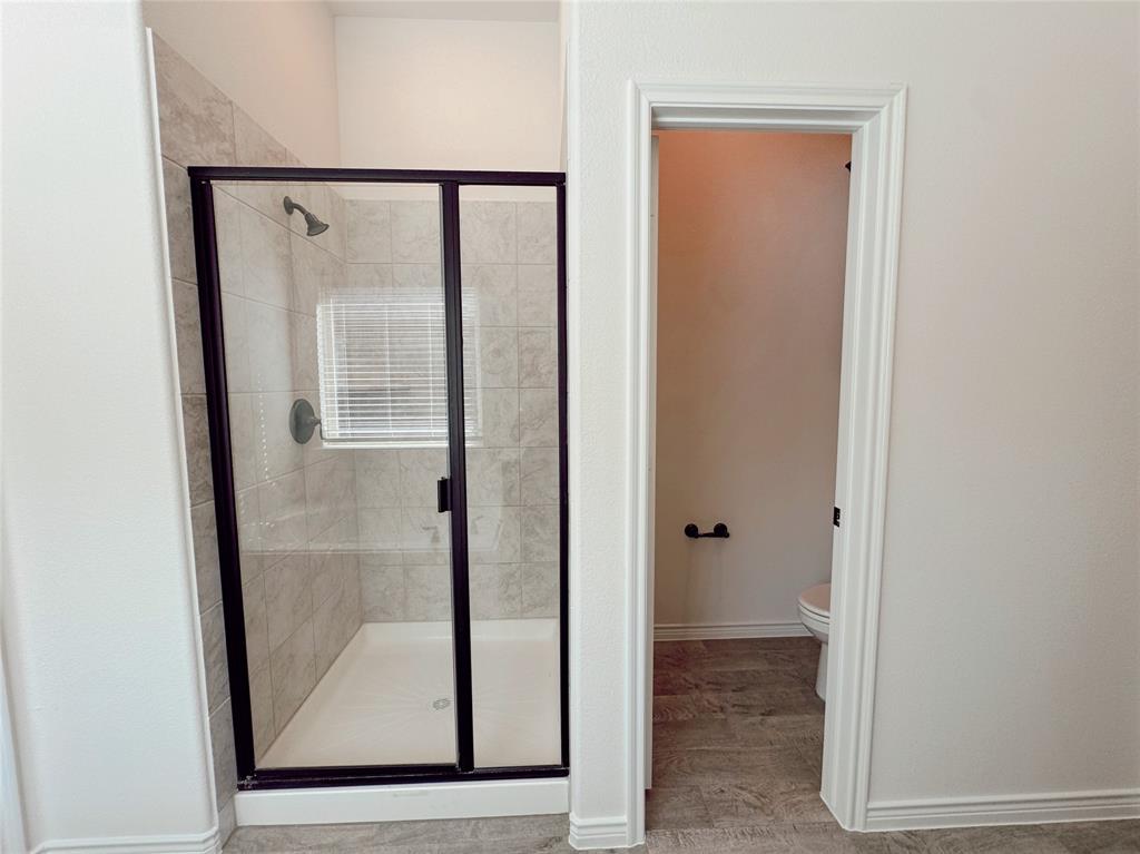 1076 Sublime Drive Forney, TX 75126 - Photo 31 of 40 a view of a bathroom with wooden floor