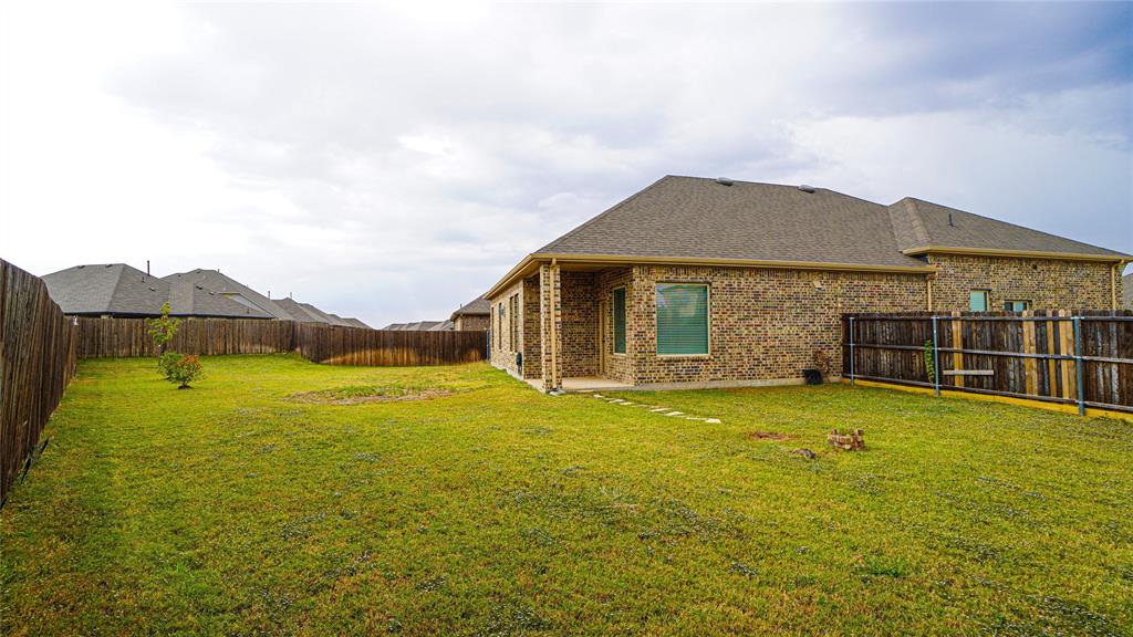 1076 Sublime Drive Forney, TX 75126 - Photo 35 of 40 a view of a house with a yard