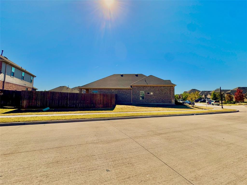 1076 Sublime Drive Forney, TX 75126 - Photo 36 of 40 a view of a swimming pool with an outdoor space and seating area