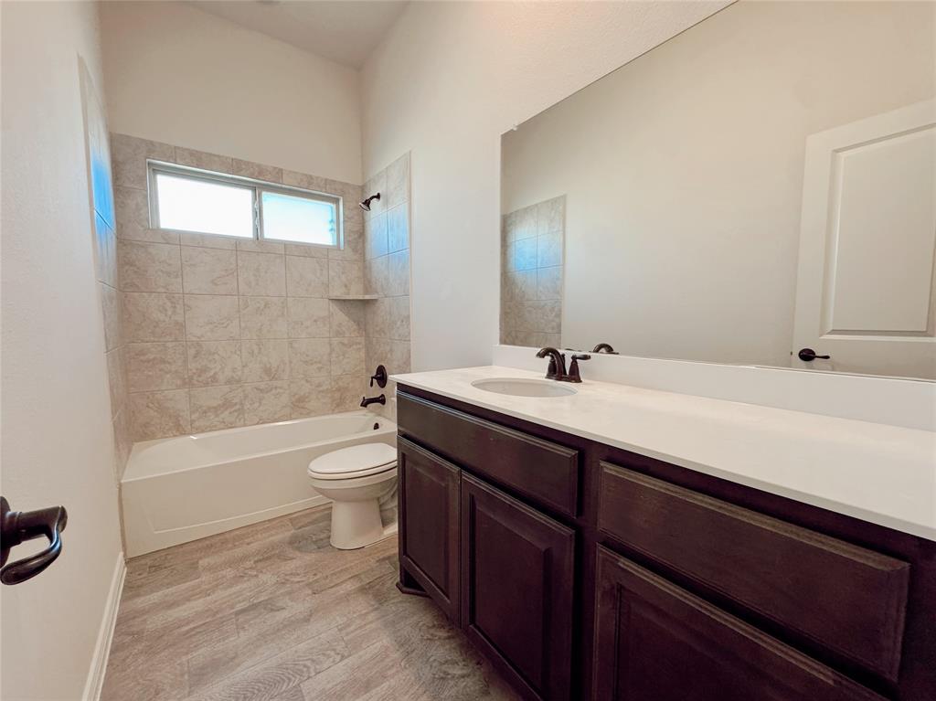 1076 Sublime Drive Forney, TX 75126 - Photo 8 of 40 a bathroom with a double vanity sink toilet and shower