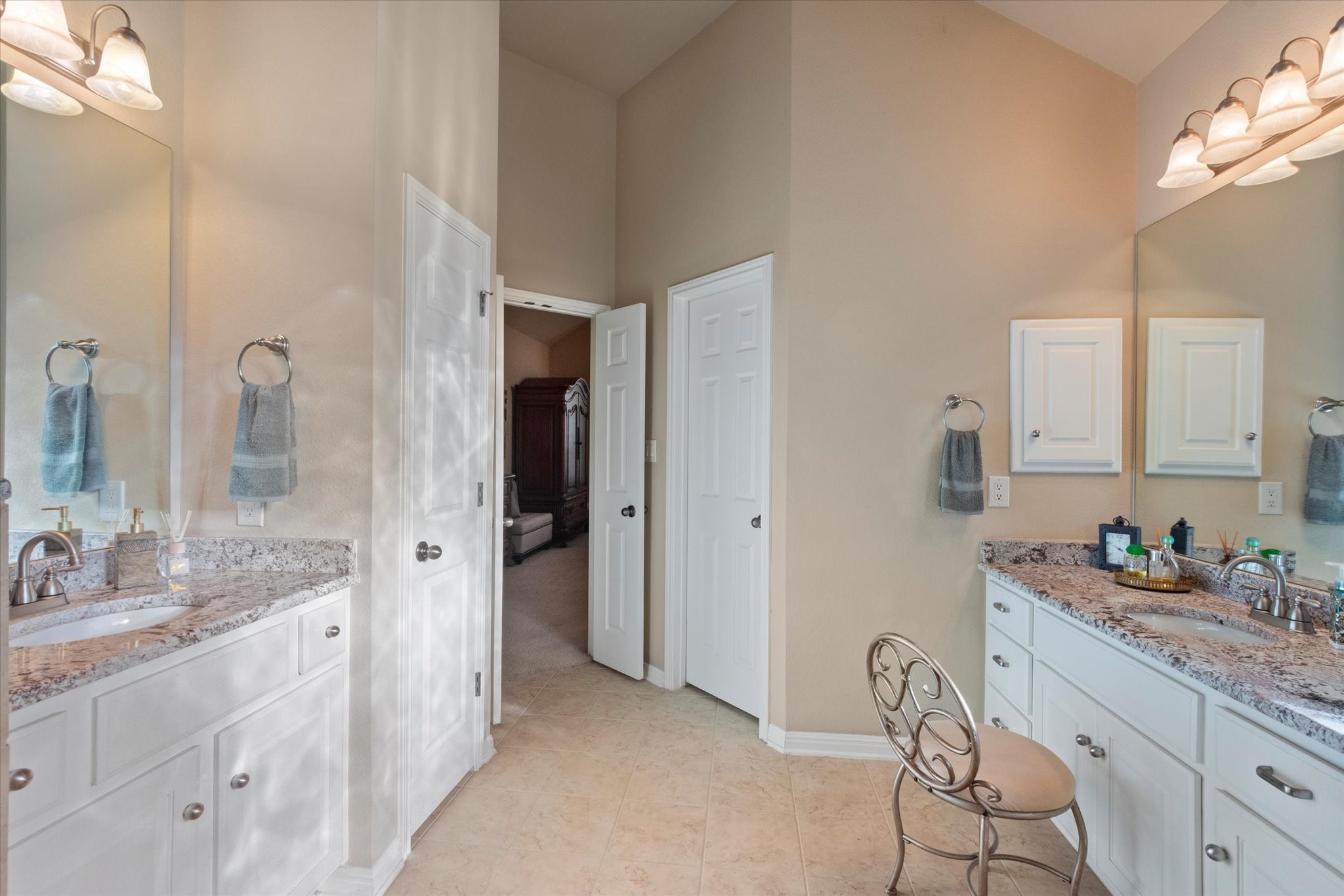 5421 Cypress Ranch Boulevard Spicewood, TX 78669 - Photo 15 of 42 a spacious bathroom with a granite countertop sink mirror and shower