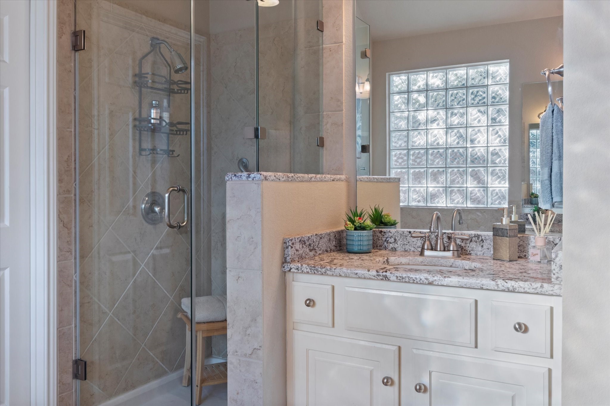 5421 Cypress Ranch Boulevard Spicewood, TX 78669 - Photo 17 of 42 a bathroom with a granite countertop shower sink and mirror