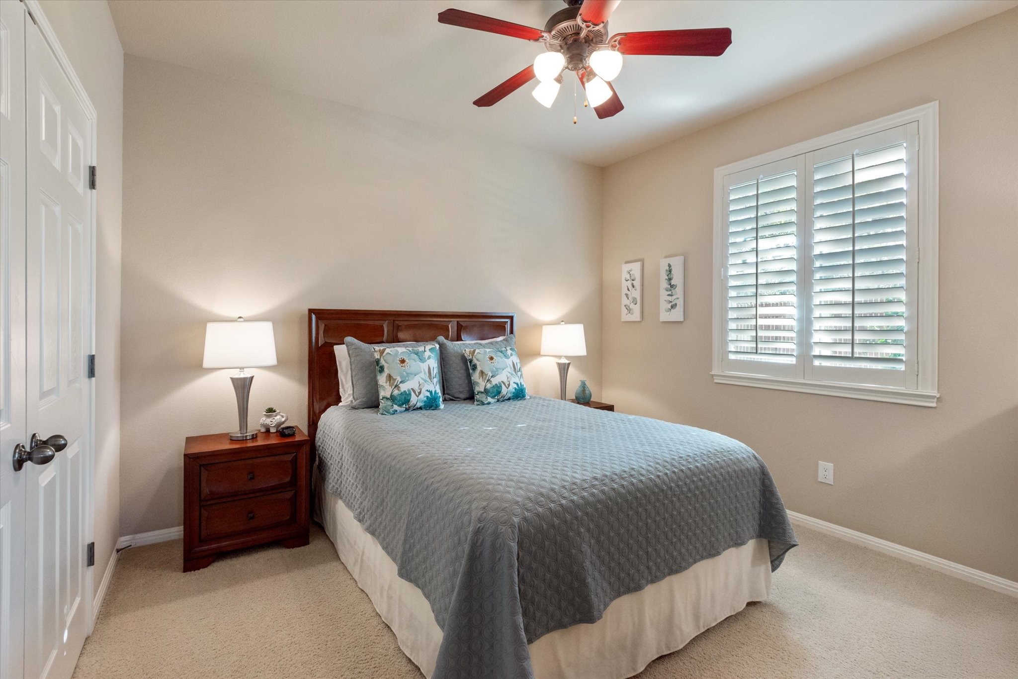 5421 Cypress Ranch Boulevard Spicewood, TX 78669 - Photo 19 of 42 a bedroom with a bed and a chandelier