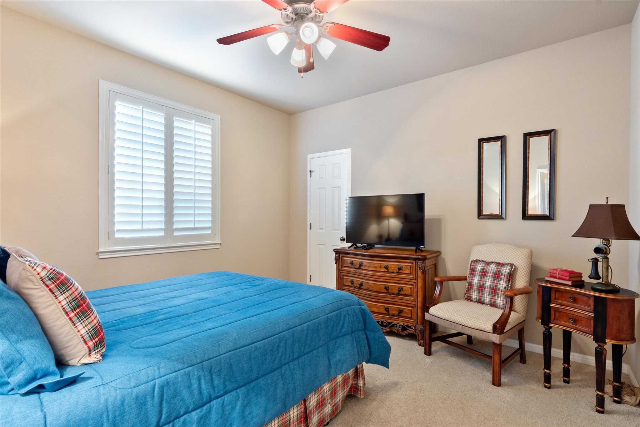 5421 Cypress Ranch Boulevard Spicewood, TX 78669 - Photo 22 of 42 a bedroom with a bed and flat screen tv