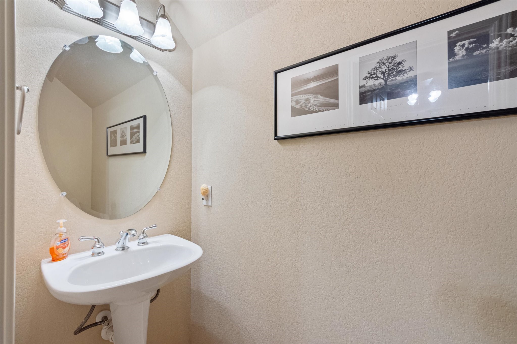 5421 Cypress Ranch Boulevard Spicewood, TX 78669 - Photo 29 of 42 a bathroom with a sink and a mirror