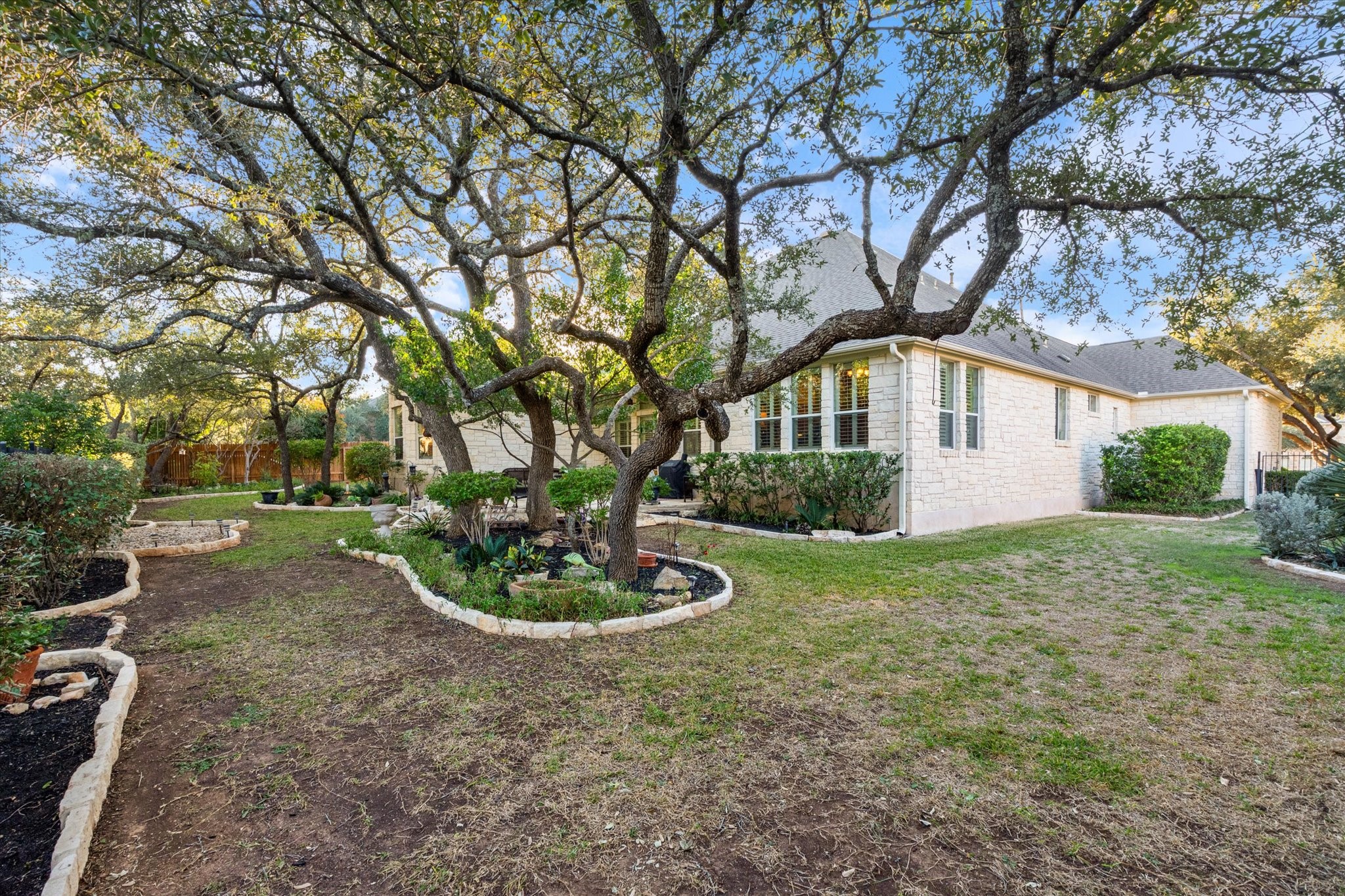 5421 Cypress Ranch Boulevard Spicewood, TX 78669 - Photo 32 of 42 a front view of a house with a yard