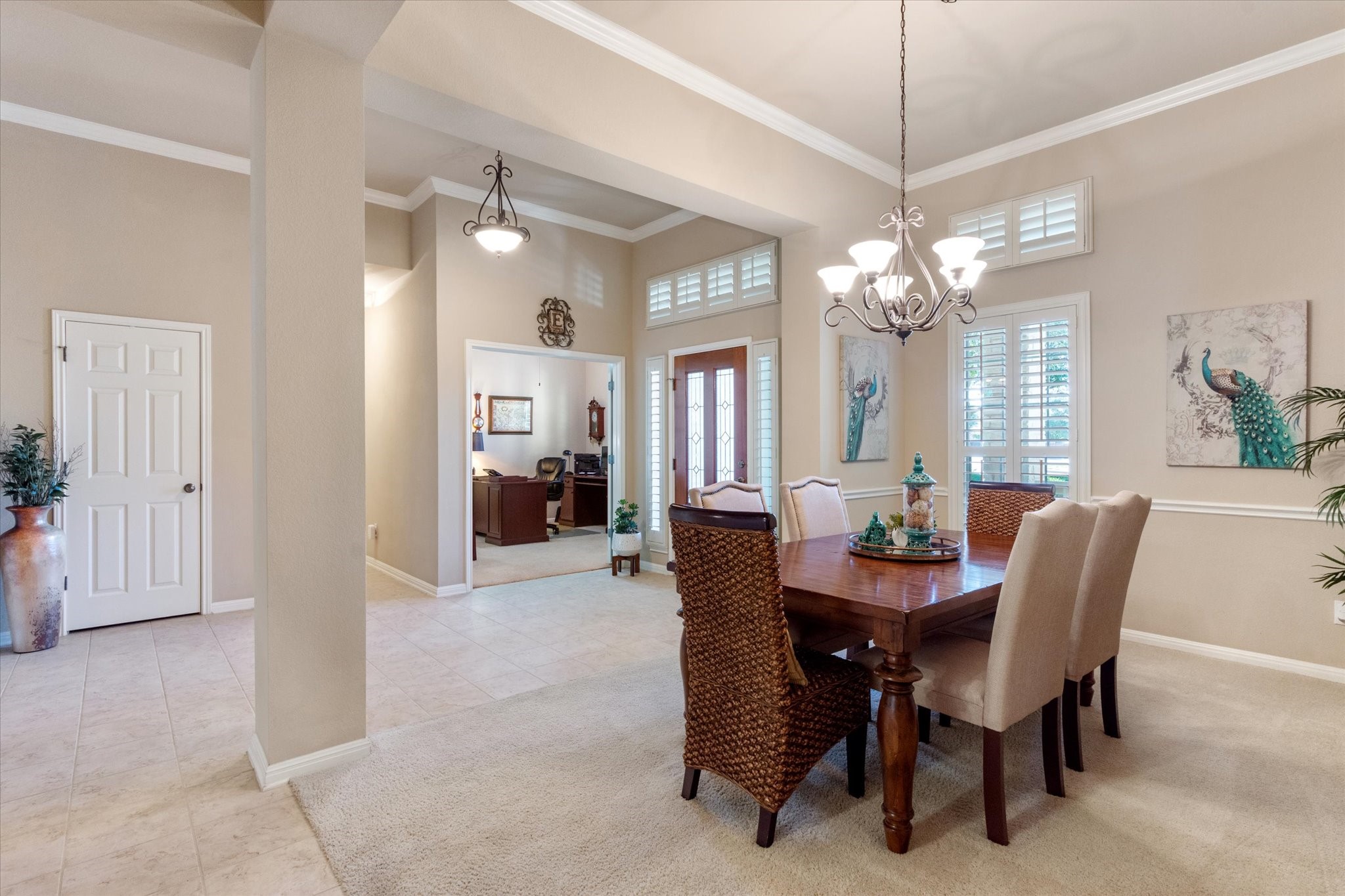 5421 Cypress Ranch Boulevard Spicewood, TX 78669 - Photo 4 of 42 a view of a dining room with furniture and chandelier