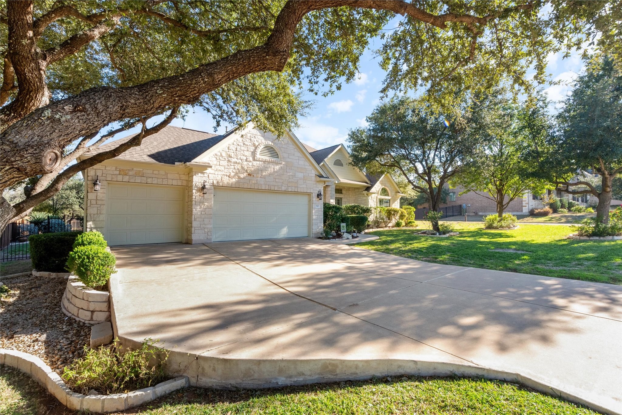 5421 Cypress Ranch Boulevard Spicewood, TX 78669 - Photo 42 of 42 a view of a yard in front of a house with large tree