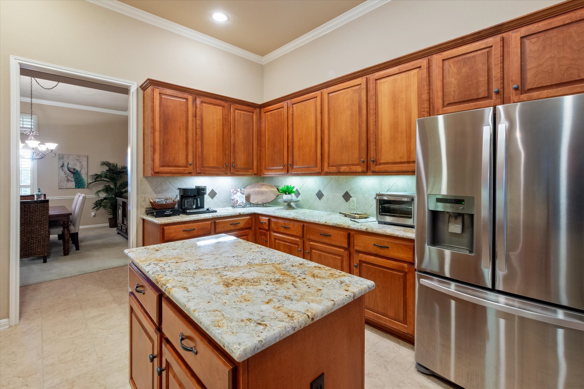 5421 Cypress Ranch Boulevard Spicewood, TX 78669 - Photo 8 of 42 a kitchen with stainless steel appliances granite countertop a refrigerator sink and cabinets