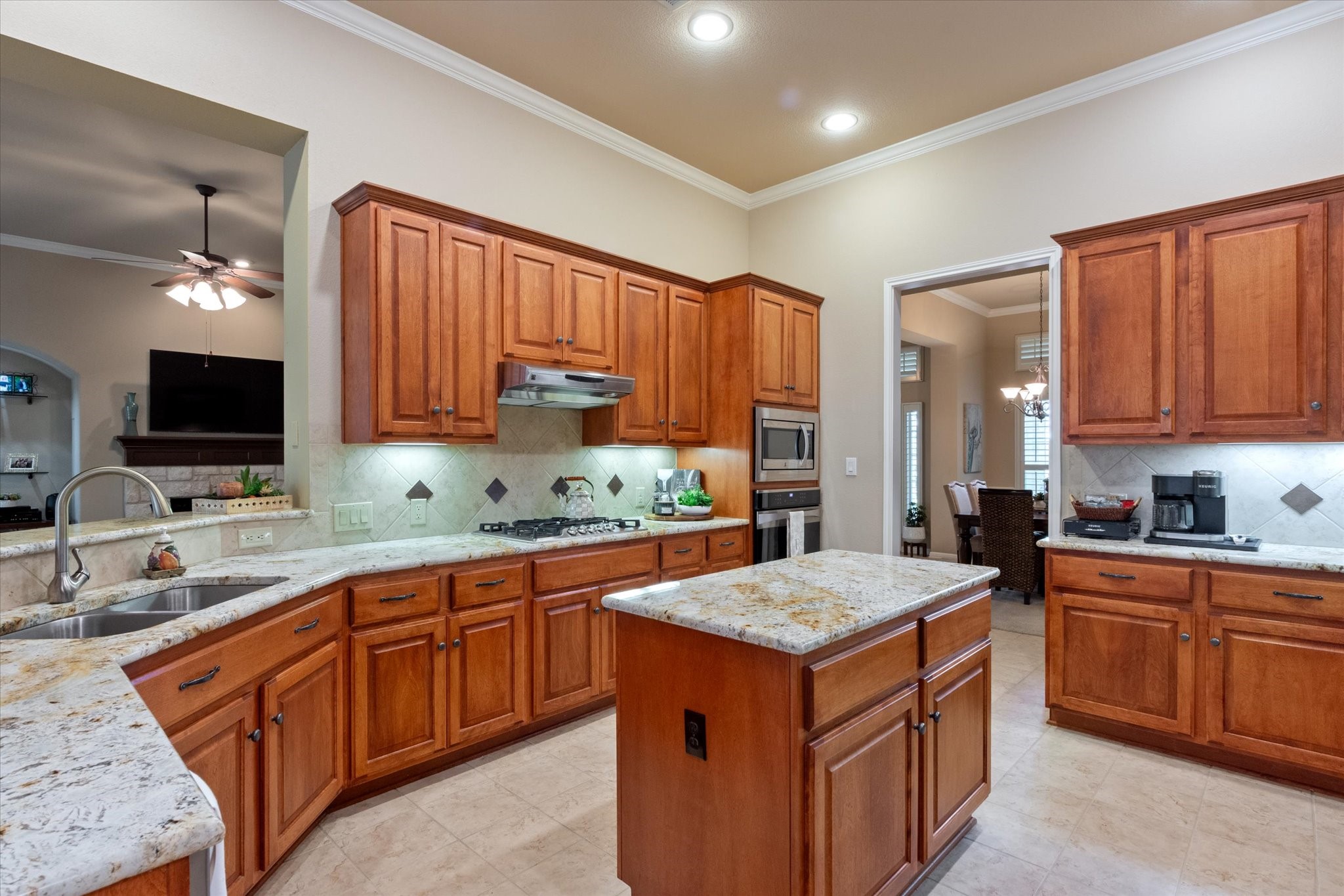 5421 Cypress Ranch Boulevard Spicewood, TX 78669 - Photo 9 of 42 a kitchen with a sink stove and cabinets