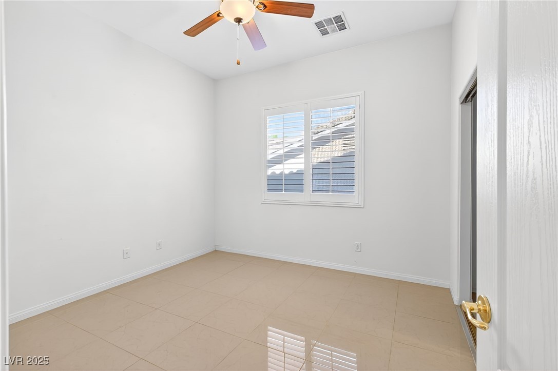 1028 Triumphant Street Henderson, NV 89052 - Photo 17 of 51 Bedroom with a ceiling fan and baseboards