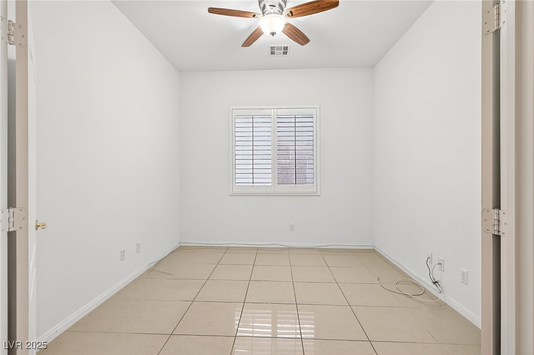 1028 Triumphant Street Henderson, NV 89052 - Photo 33 of 51 Den/Room with light tile patterned floors and a ceiling fan