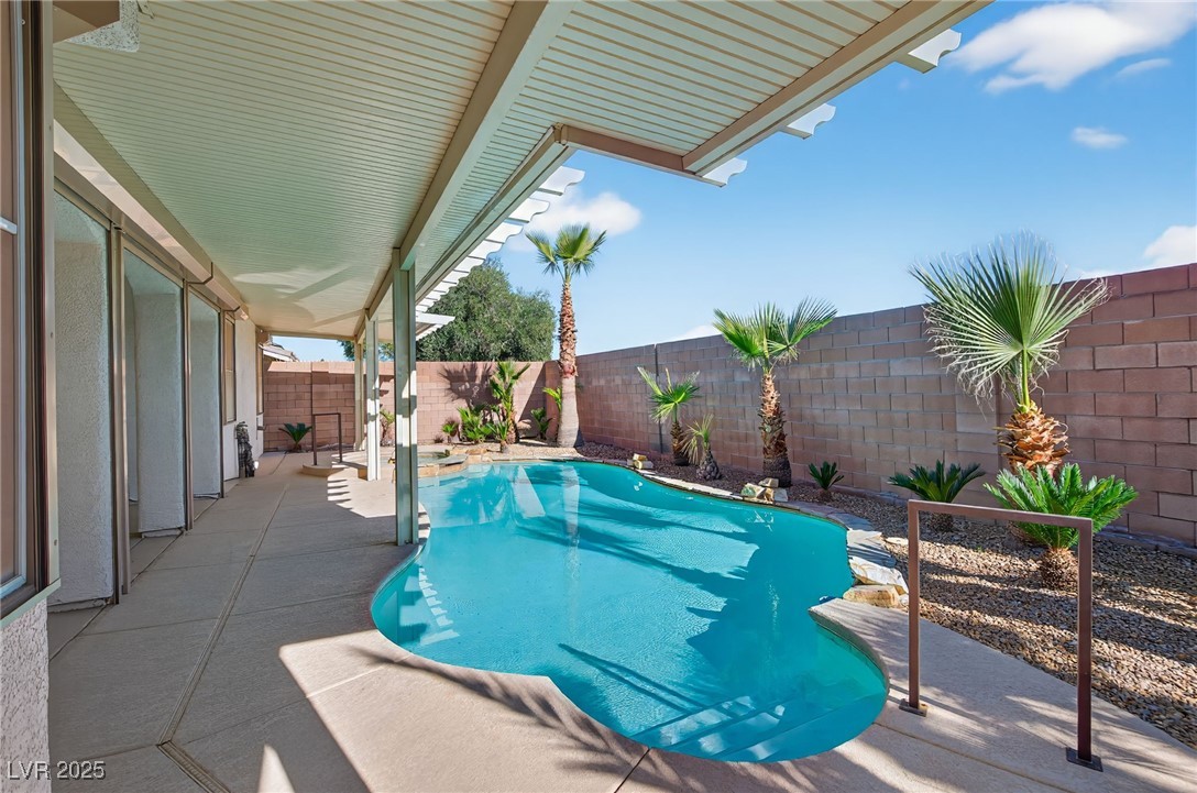 1028 Triumphant Street Henderson, NV 89052 - Photo 39 of 51 View of pool featuring a fenced backyard and a patio area