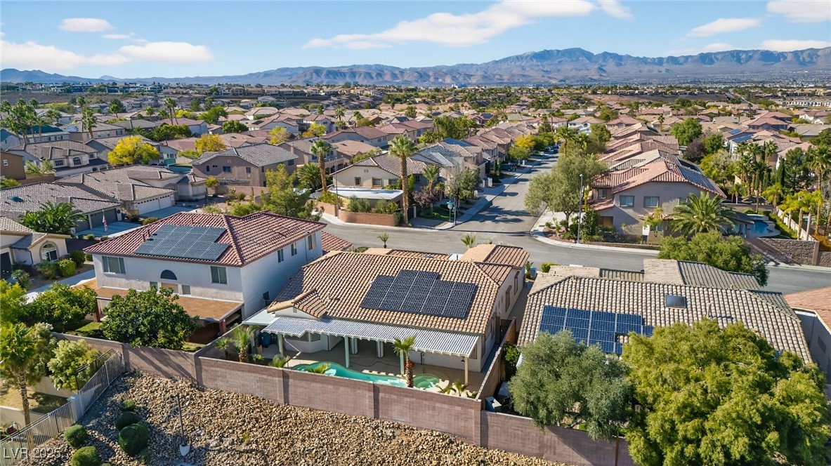 1028 Triumphant Street Henderson, NV 89052 - Photo 43 of 51 Drone / aerial view of a mountain backdrop and a pool area