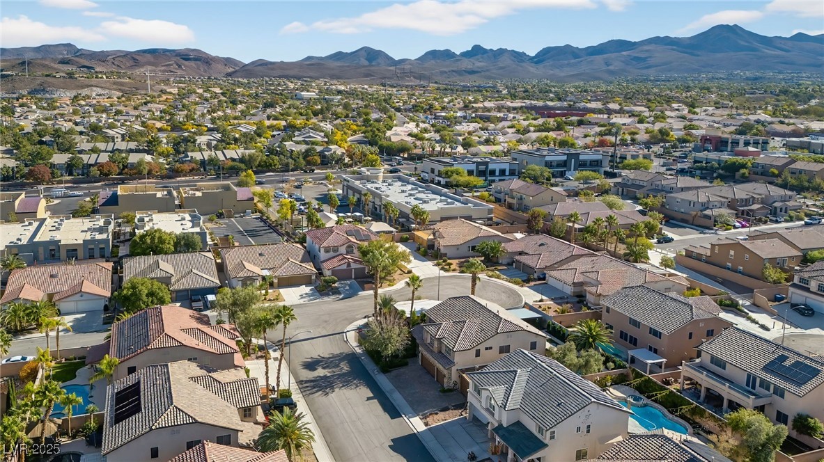 1028 Triumphant Street Henderson, NV 89052 - Photo 45 of 51 Aerial view of residential area featuring a mountainous background